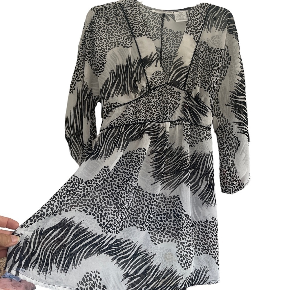 Lavender Star size large black and white super sheer‎ flare sleeve tunic blouse.